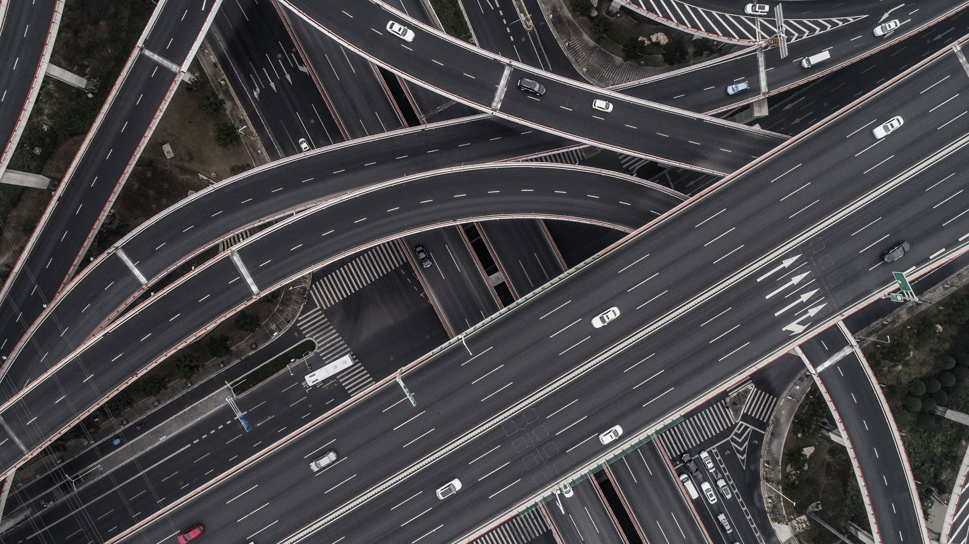 Aerial view of highway and overpass in city on a cloudy day