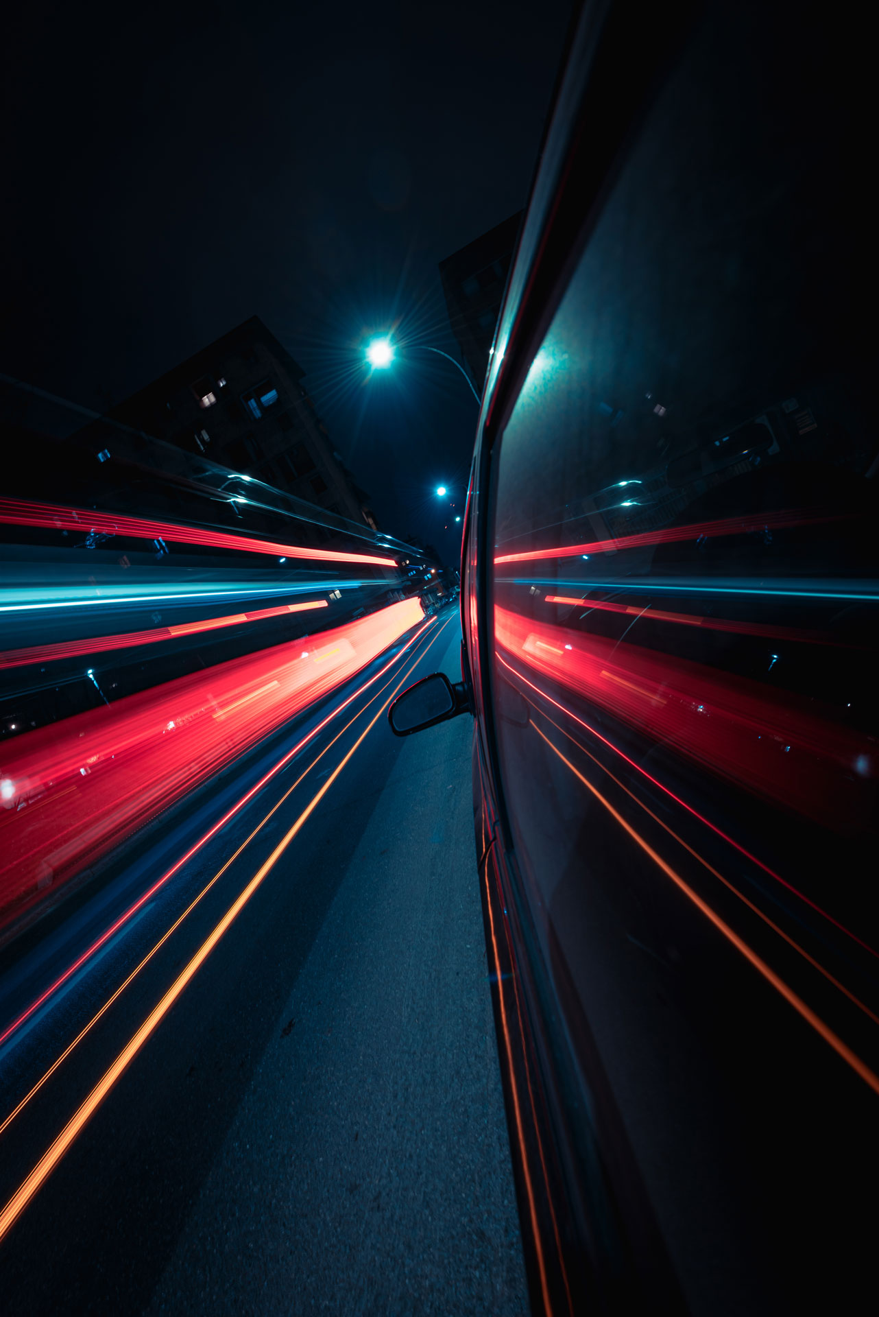 light trails reflections on a car window.