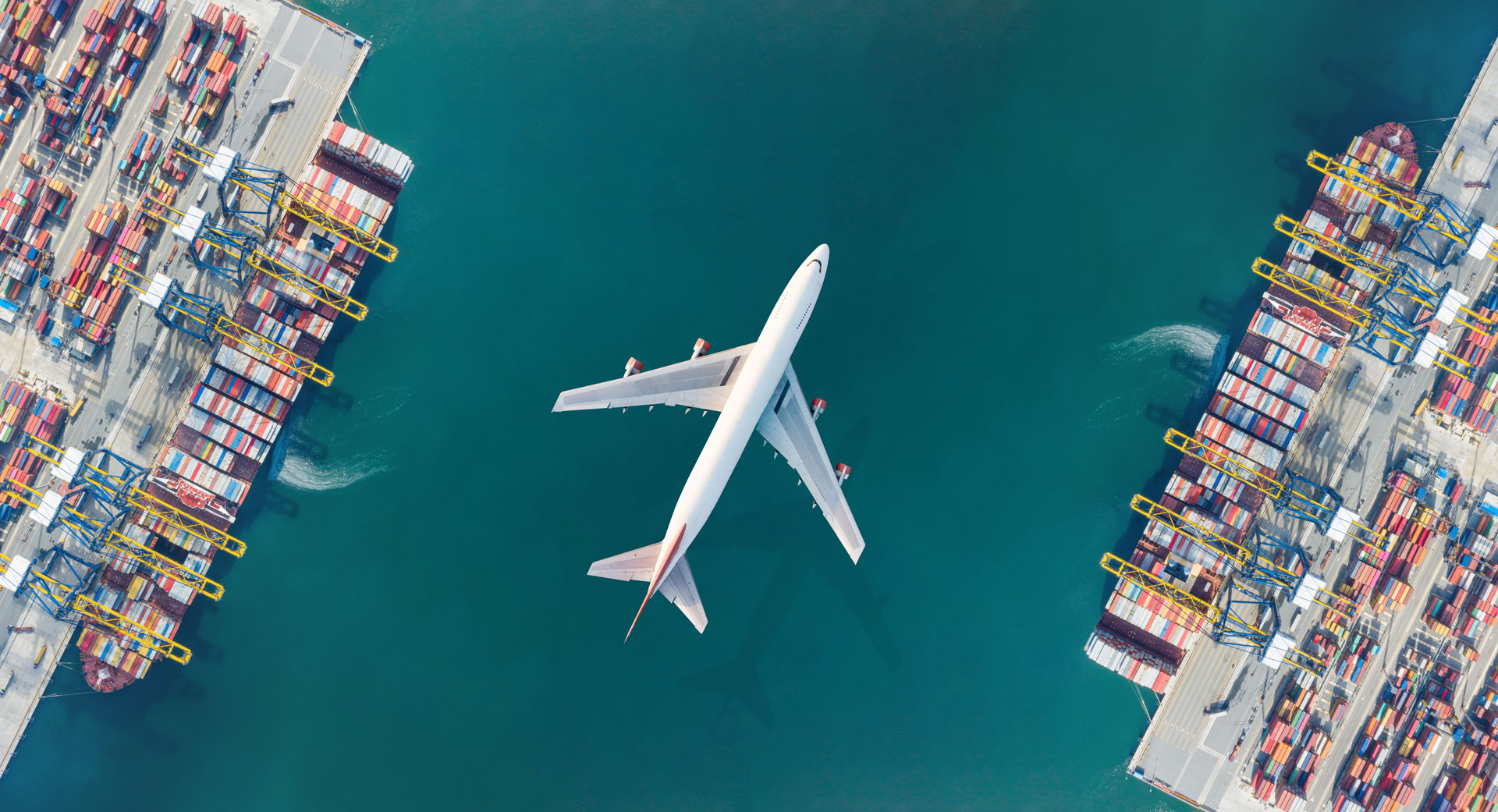 Aerial top view of Container ship loading and unloading, Cargo container in deep seaport for the international order. Transportation and travel concept.